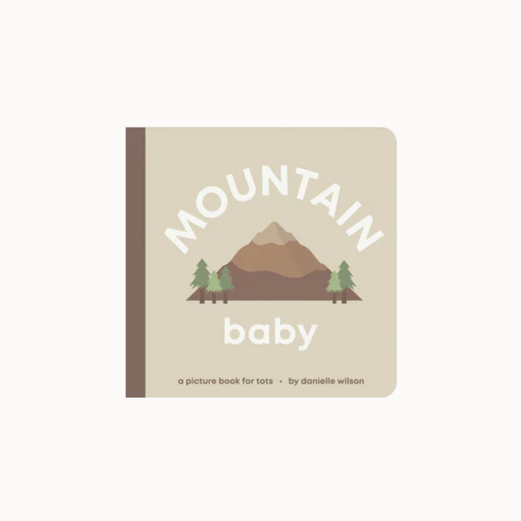 Book titled 'Mountain Baby' with a mountain and trees illustration on a beige background