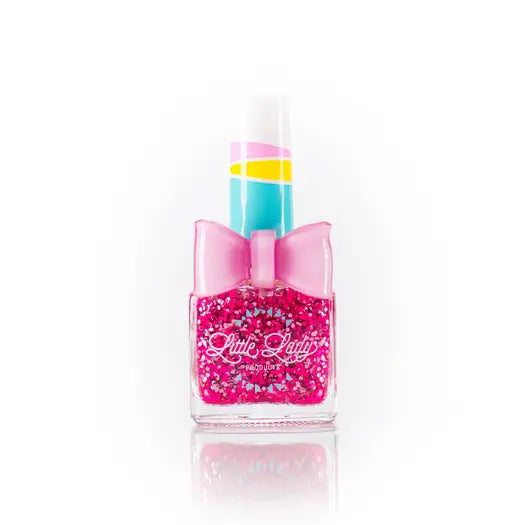 Pink nail polish bottle with a bow on a white background