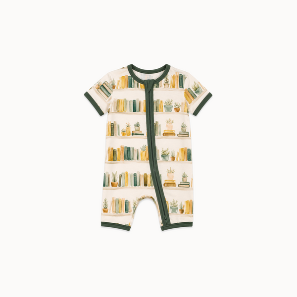 Library-patterned onesie on a white background