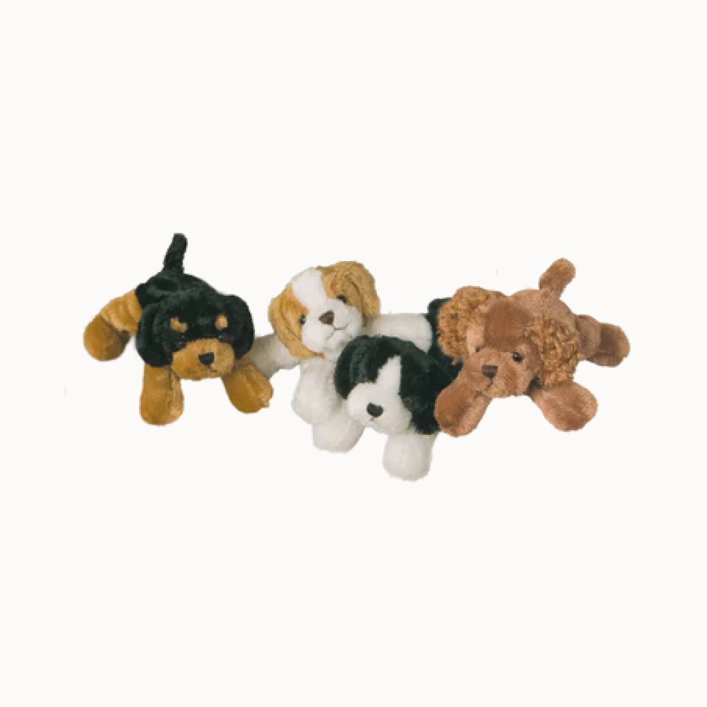 Four plush dog toys in different colors on a white background