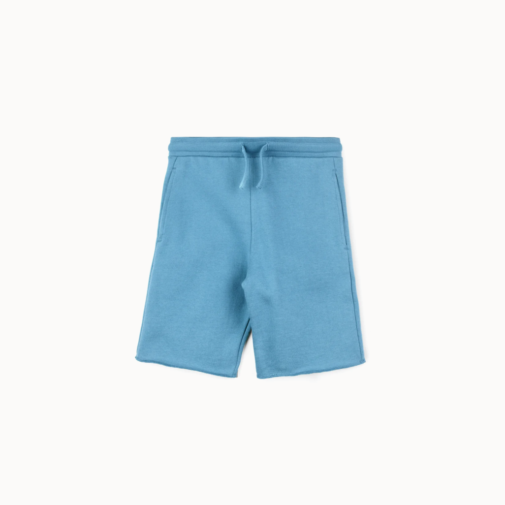 Blue shorts with a drawstring on a white background