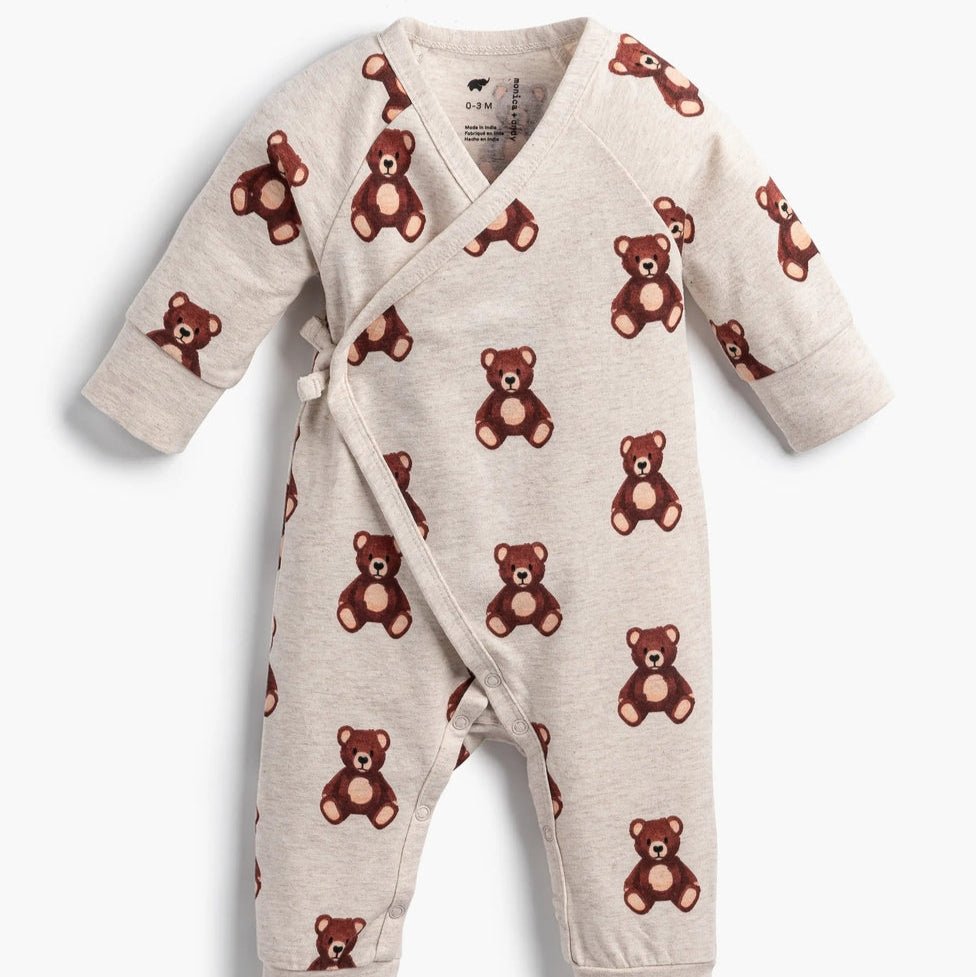 Baby onesie with teddy bear pattern on a white background