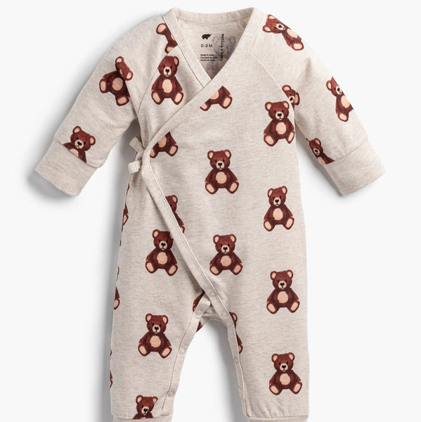 Baby onesie with teddy bear pattern on a white background