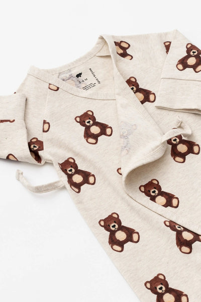 Baby outfit with bear pattern on a white background