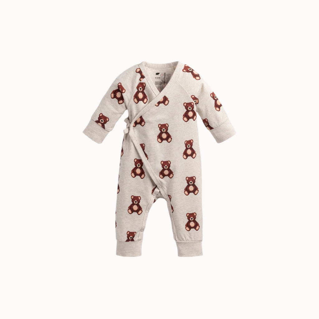 Baby romper with teddy bear pattern on a white background
