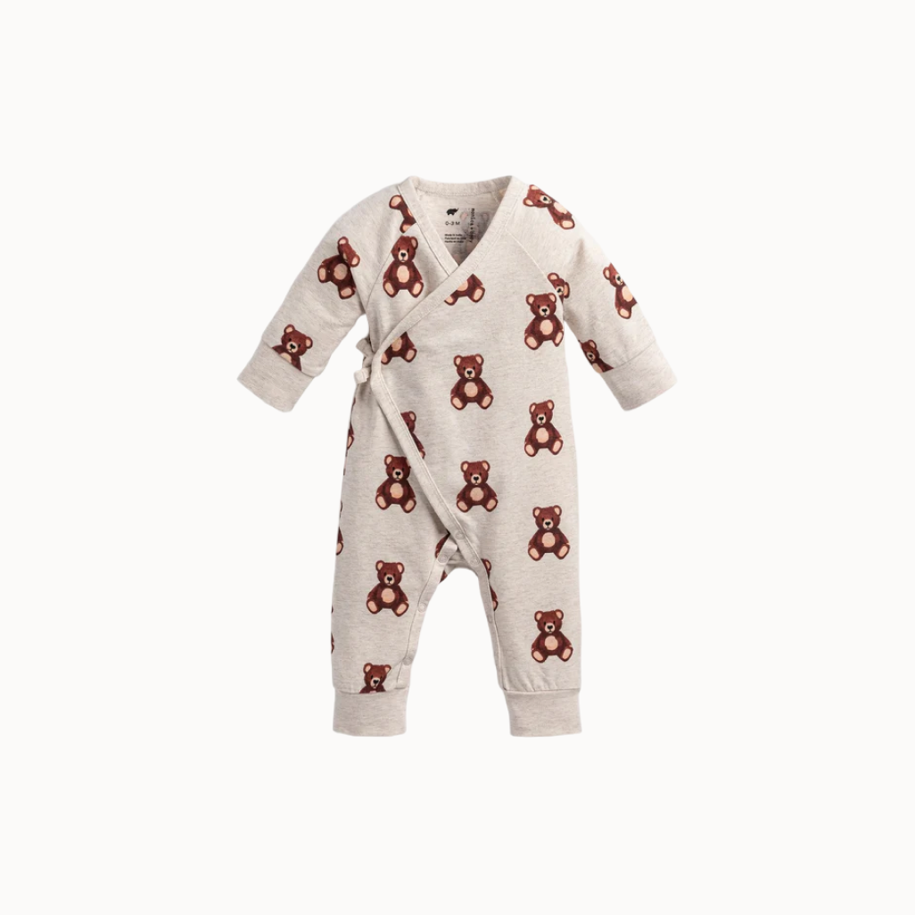 Baby romper with teddy bear pattern on a white background