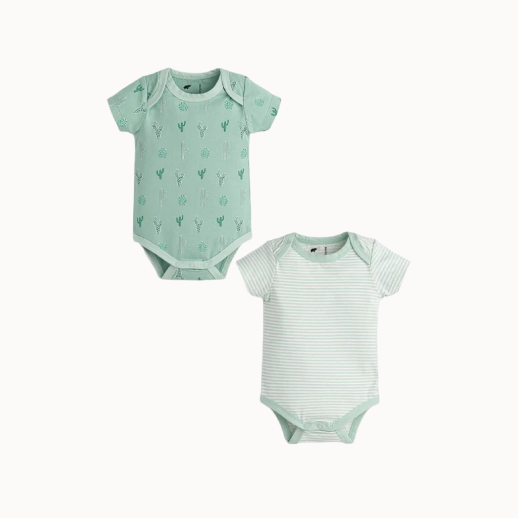 Two green baby bodysuits with different patterns on a white background