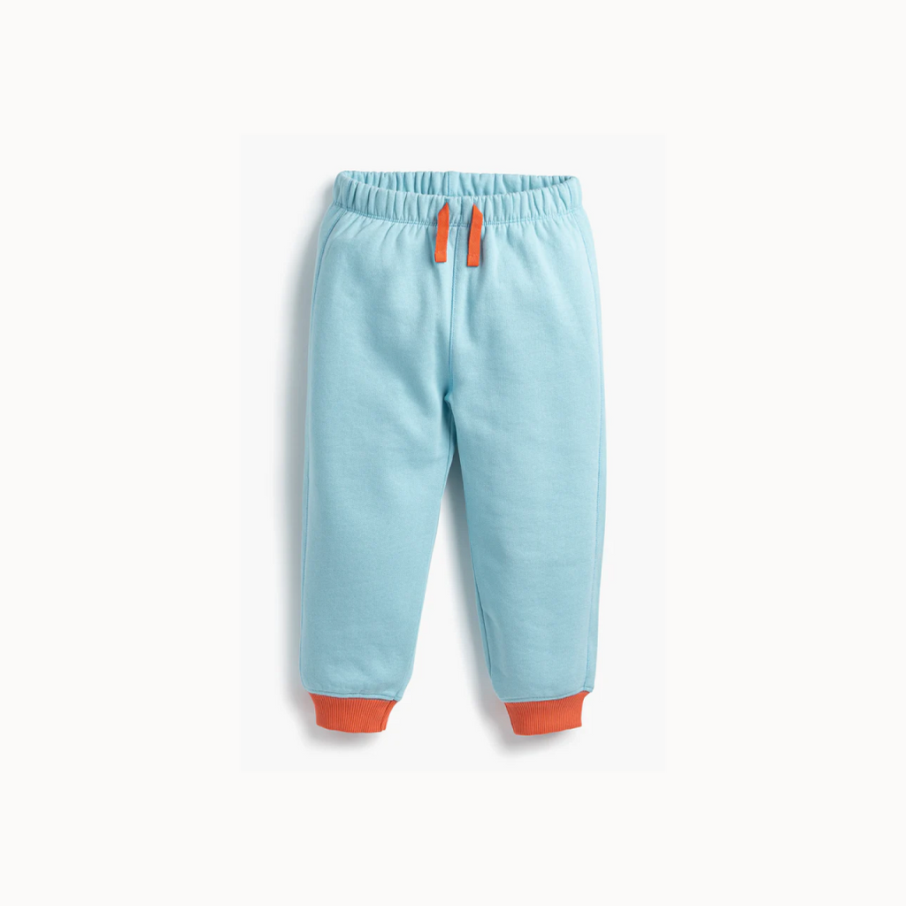Light blue pants with orange accents on a white background