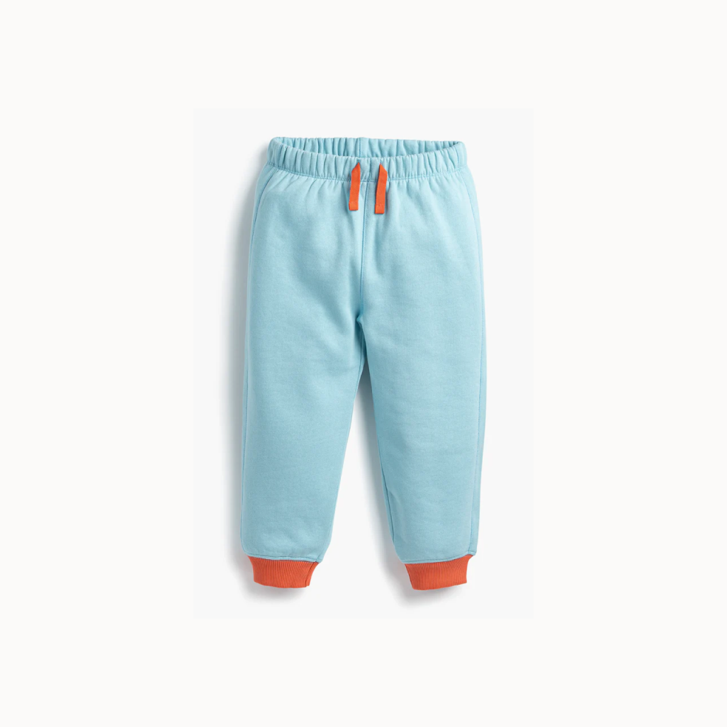 Light blue pants with orange accents on a white background