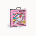 Pink packaging of 'Unicorn Dreams' color magic bath book with a unicorn and rainbow illustration.