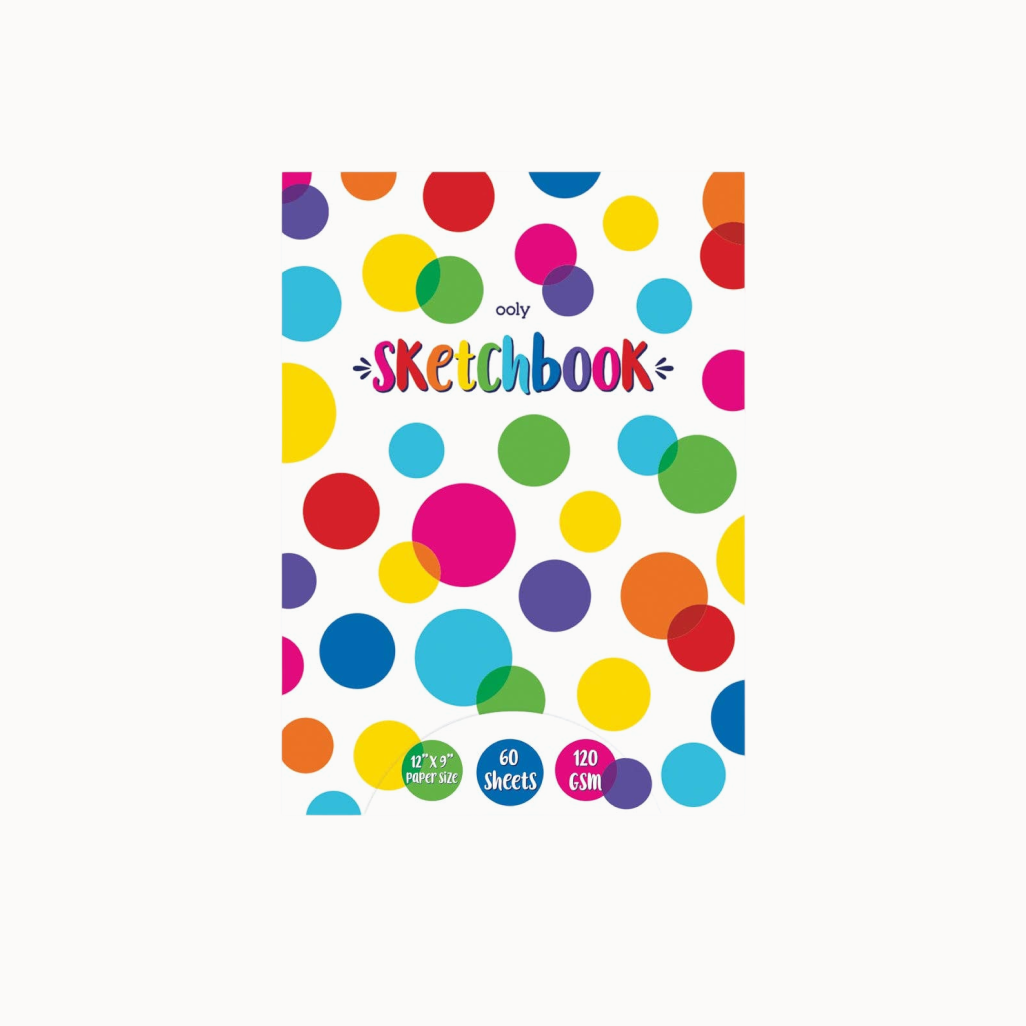 Sketchbook with colorful polka dot design on a white background
