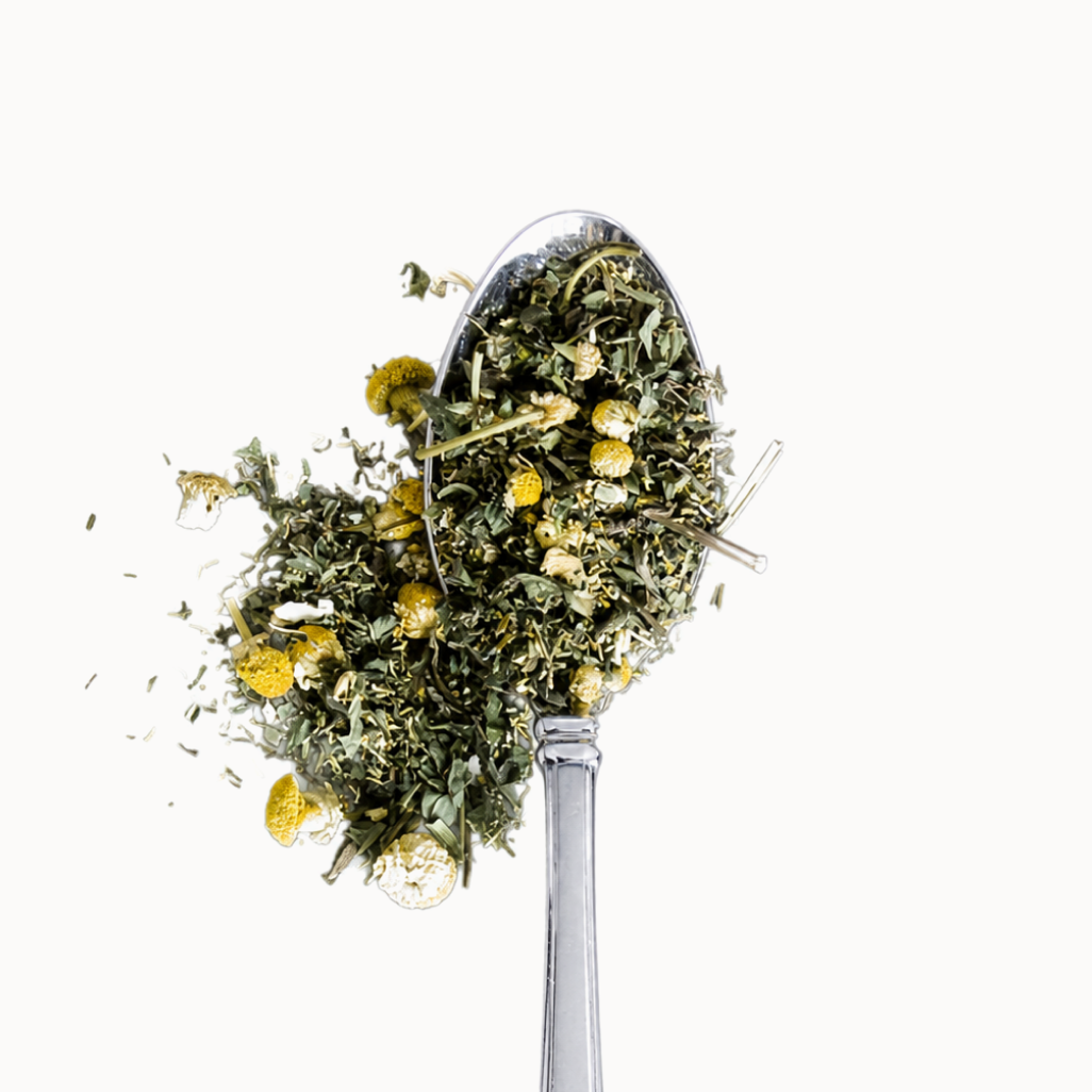 Tea herbs on a metal spoon