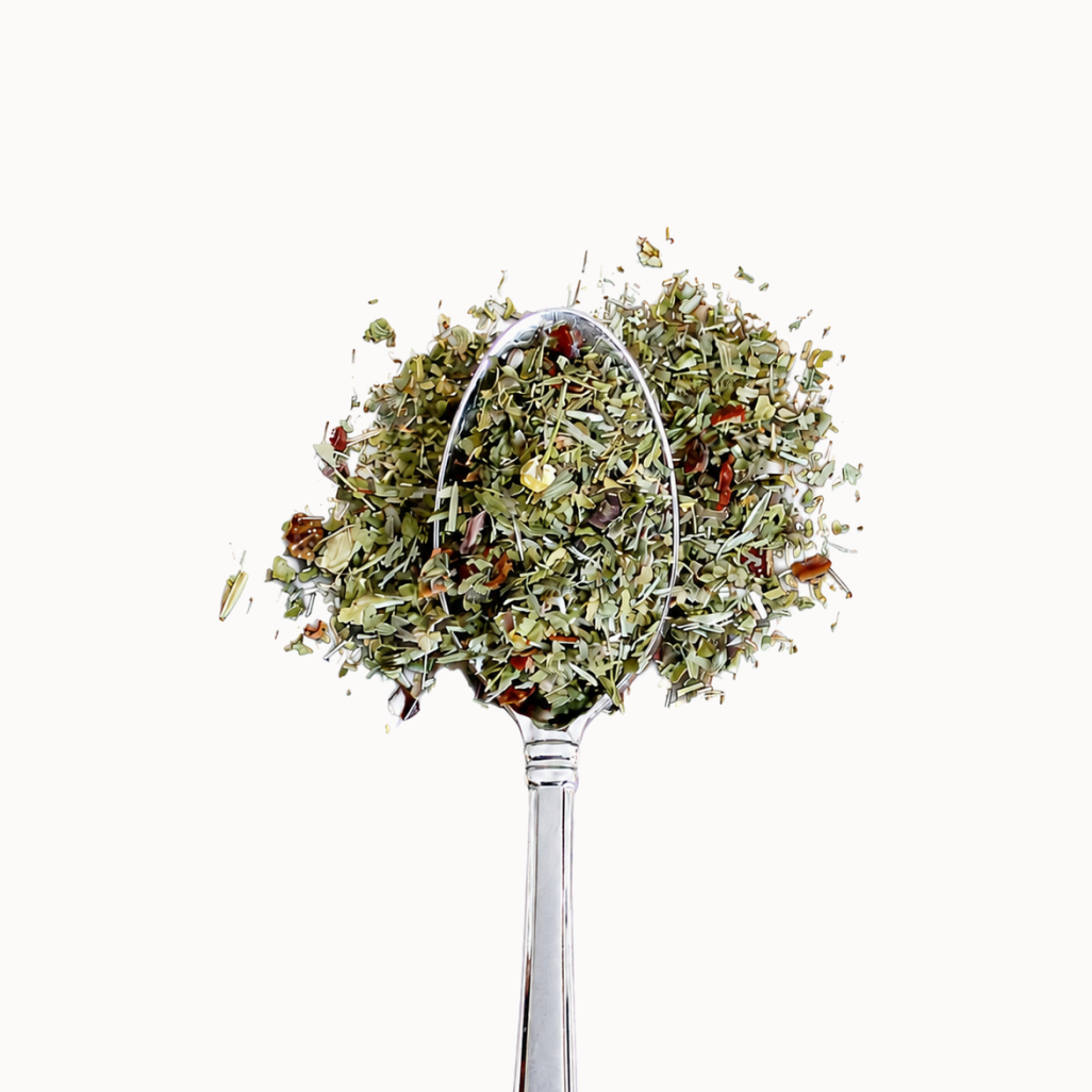 Tea herbs on a metal spoon