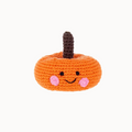 Orange crocheted pumpkin rattle with smiley face