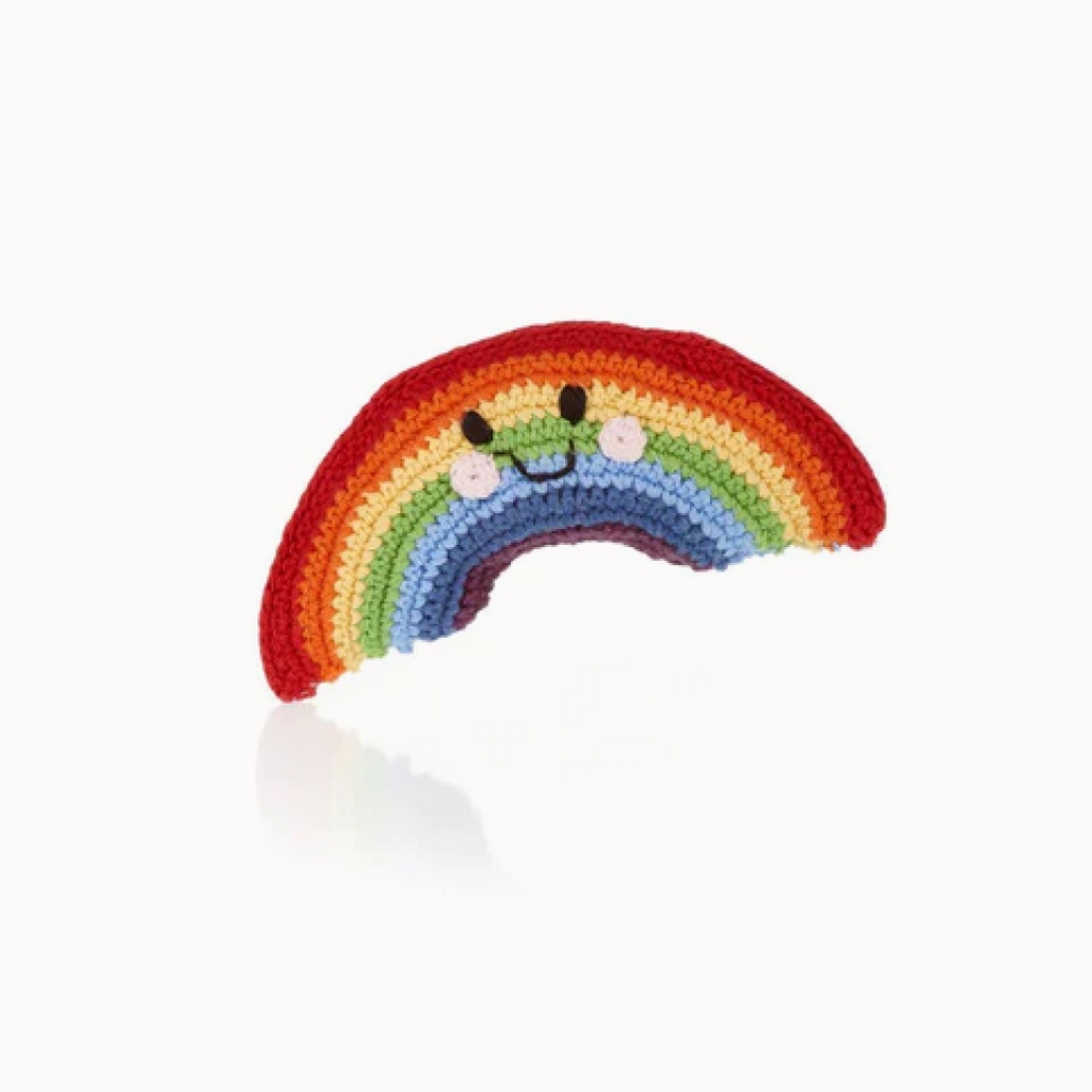 rainbow yarn baby toy on a white background
