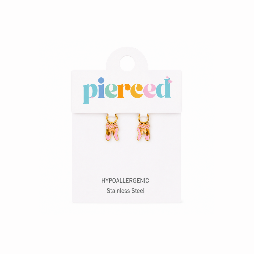 Pair of gold ballet slipper earrings on a 'pierced' branded card with white background