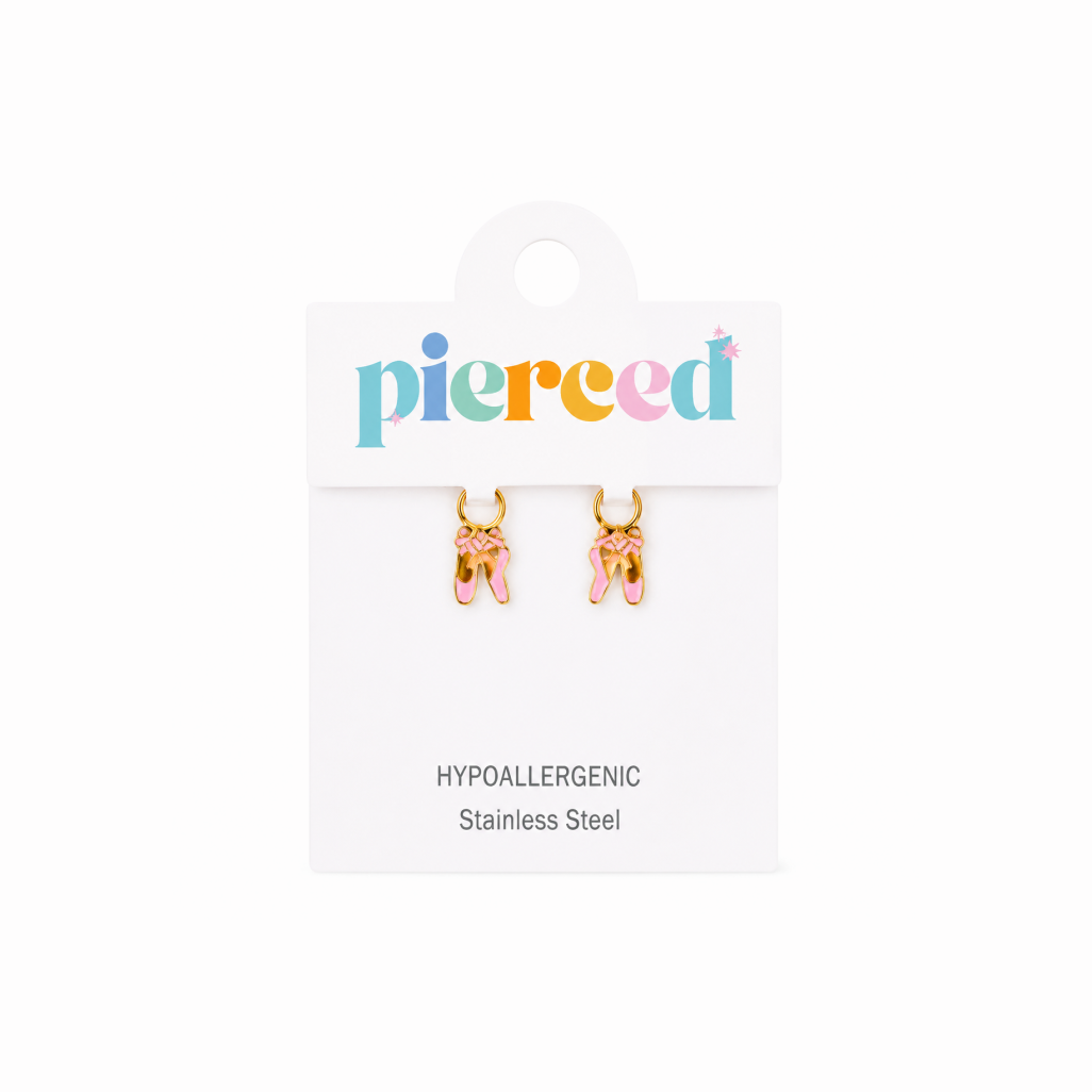 Pair of gold ballet slipper earrings on a 'pierced' branded card with white background