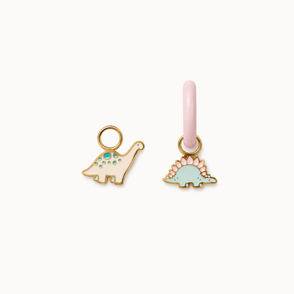 Two dinosaur-shaped charms on a white background