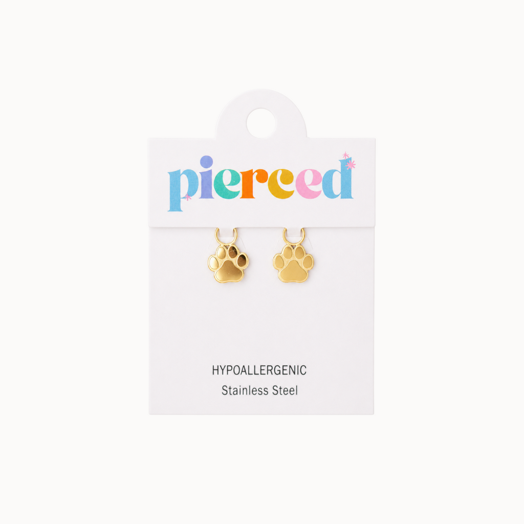 Gold paw-shaped earrings on a 'pierced' branded card with a white background