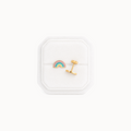 Rainbow-shaped earrings in a white jewelry box on a white background
