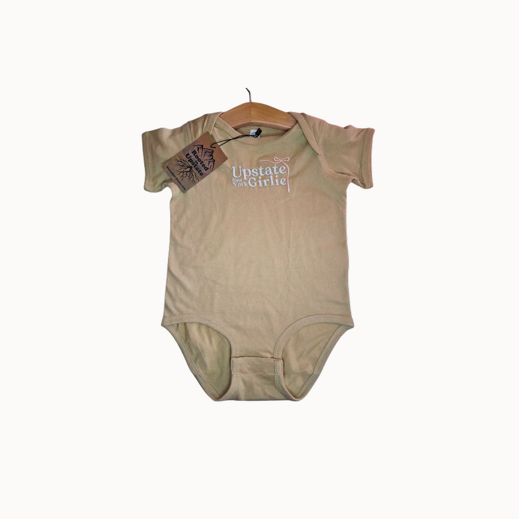 Beige onesie with text on a white background