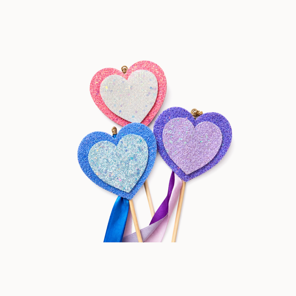 3 colorful heart shaped ribbon wands on a white background