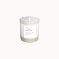 A frosted glass jar candle with a white label reading 'Blossom & Co. Forest Bathing' and a visible flame, centered on a plain white background.