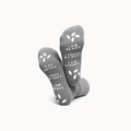 Gray socks with motivational text on a white background