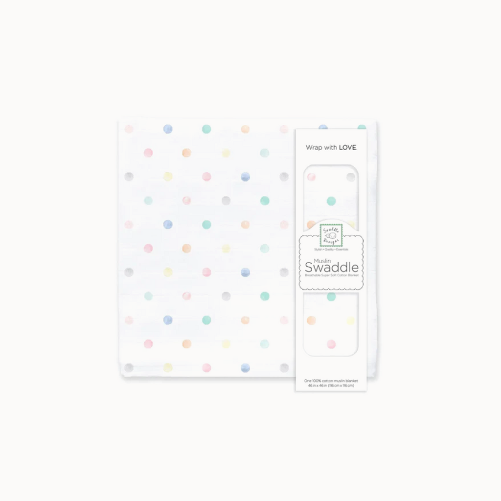 Cotton muslin swaddle blanket with colorful polka dots and packaging on a white background