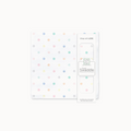 Cotton muslin swaddle blanket with colorful polka dots and packaging on a white background