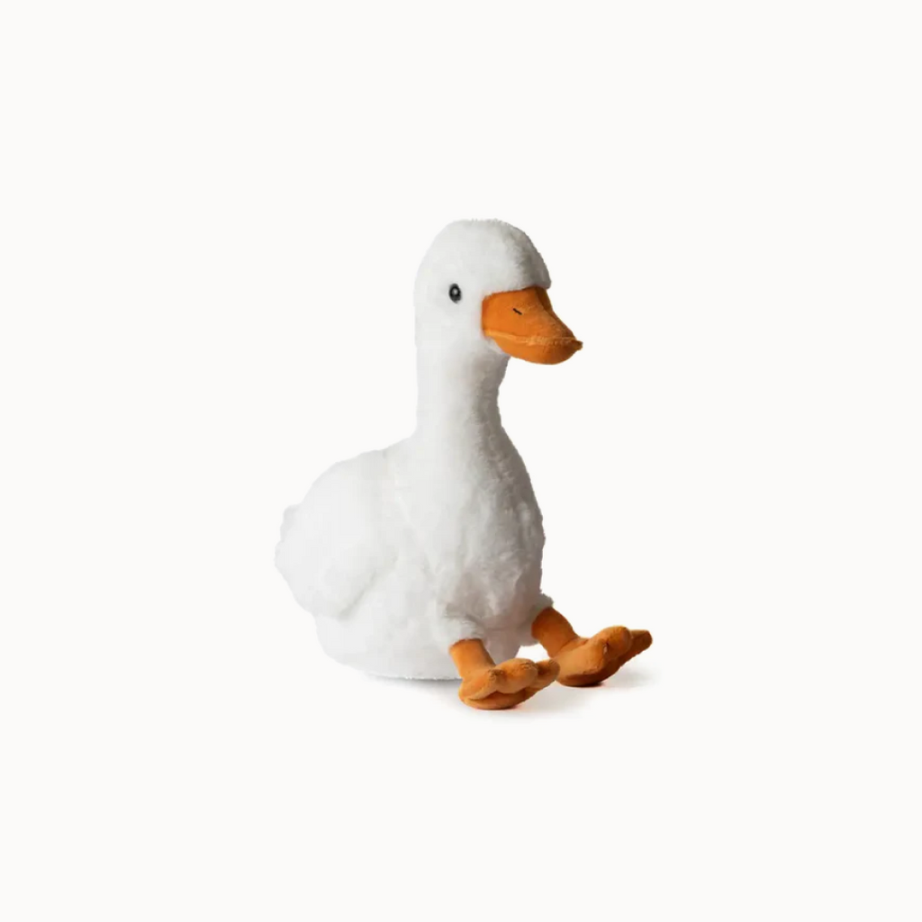 Plush toy duck with white body and orange feet and beak on a white background
