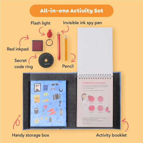 All-in-one activity set with flash light, invisible ink spy pen, red inkpad, secret code ring, pencil, handy storage box, and activity booklet on a yellow background.