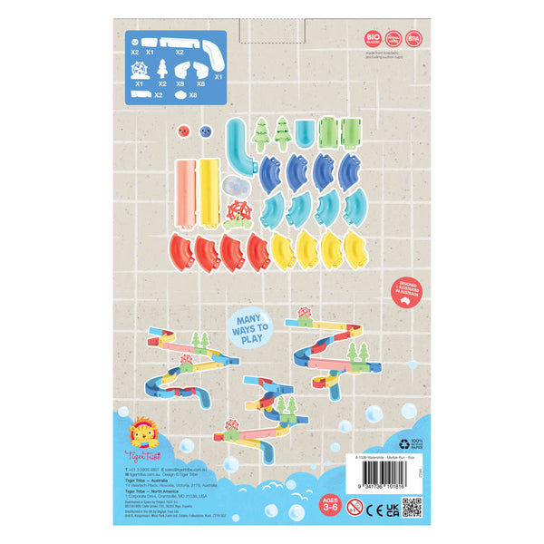 Product packaging with colorful toy parts and game layout on a beige background