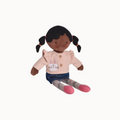 Doll with black hair in pigtails, a pink ruffled shirt, and jean skirt.