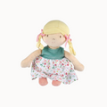 Plush doll with blonde hair, green top, and floral dress on a white background