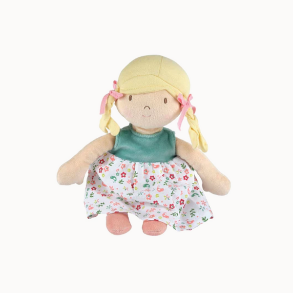Plush doll with blonde hair, green top, and floral dress on a white background