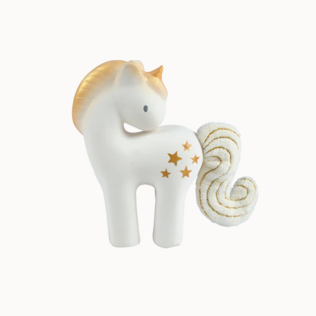 White unicorn figurine with gold stars and accents on a white background