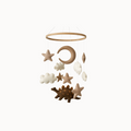Brown and white nursery mobile with stars, cloud, moon, and dinosaur