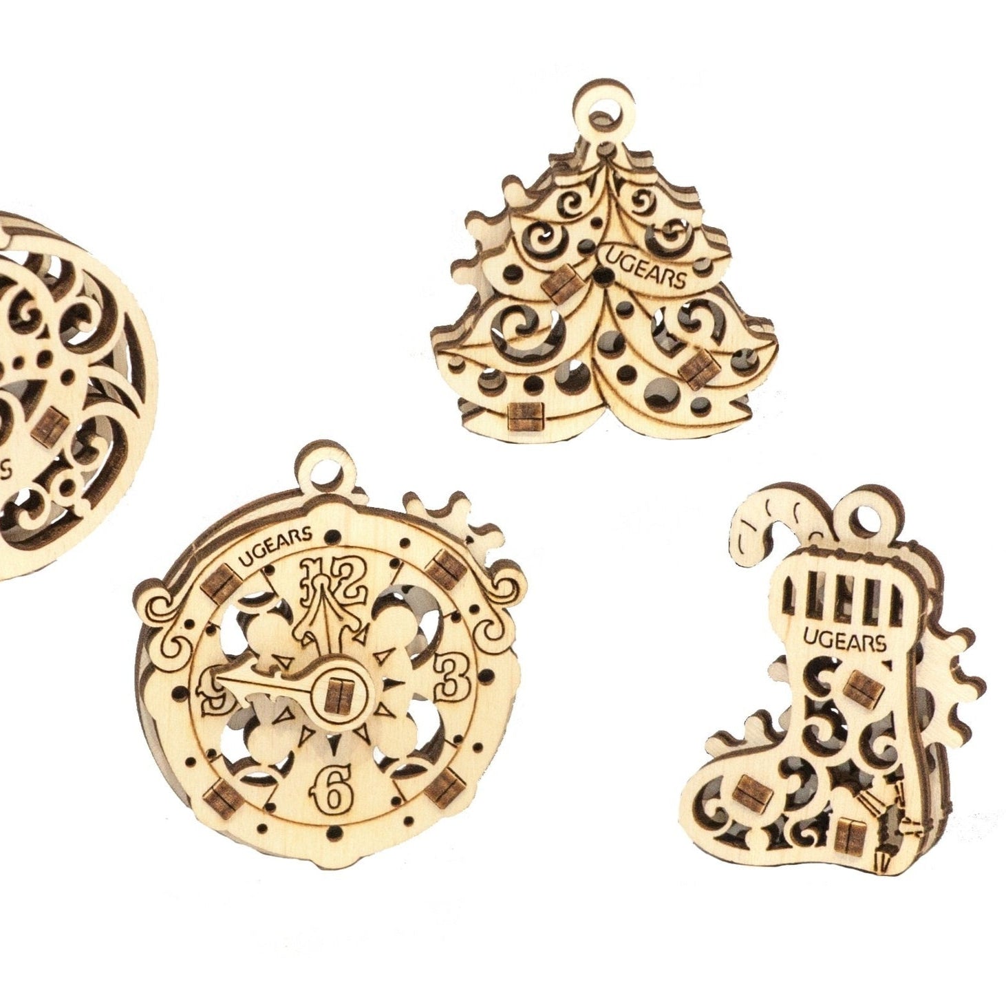 Wooden holiday ornaments on white background 