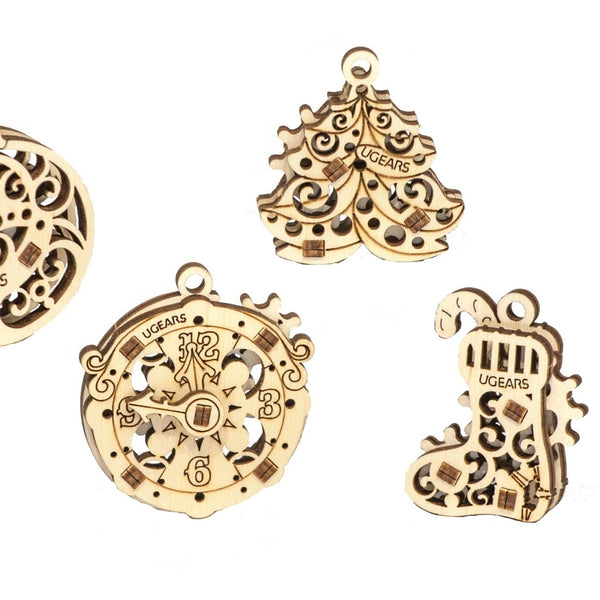 Wooden holiday ornaments on white background 