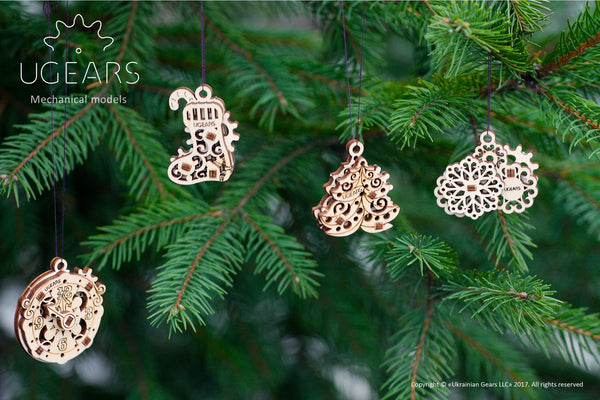 Wooden holiday ornaments on tree