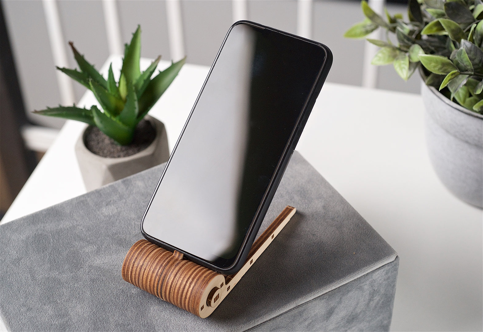 Wooden phone holder on a white background