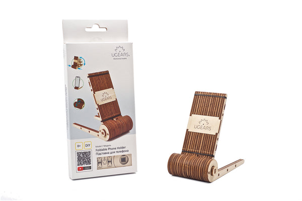 Wooden phone holder on a white background with packaging 