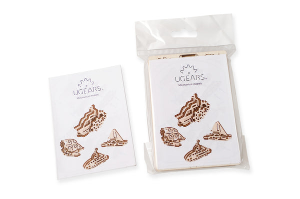 Ugears packaging of wooden ship puzzles on white background