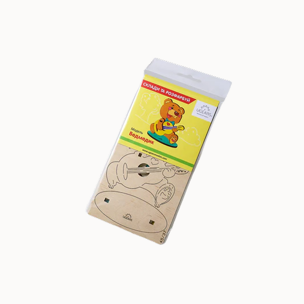 wooden toys in a package with a bear on it and UGEARS branding.