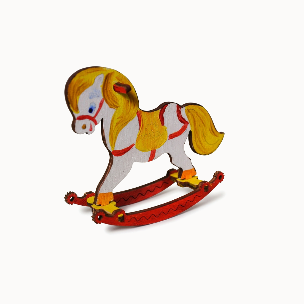 Painted wooden horse model on a white background
