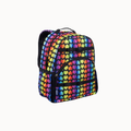 A backpack with a vibrant rainbow heart pattern, black straps, and black trim, shown against a plain light gray background.