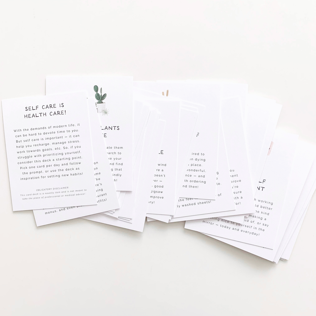 Set of printed cards with text on a white surface