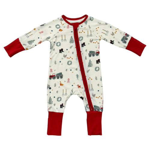 A baby long-sleeve footless sleeper with a red zipper, red cuffs, and red leg cuffs, featuring a white background with a colorful farm and construction-themed print.