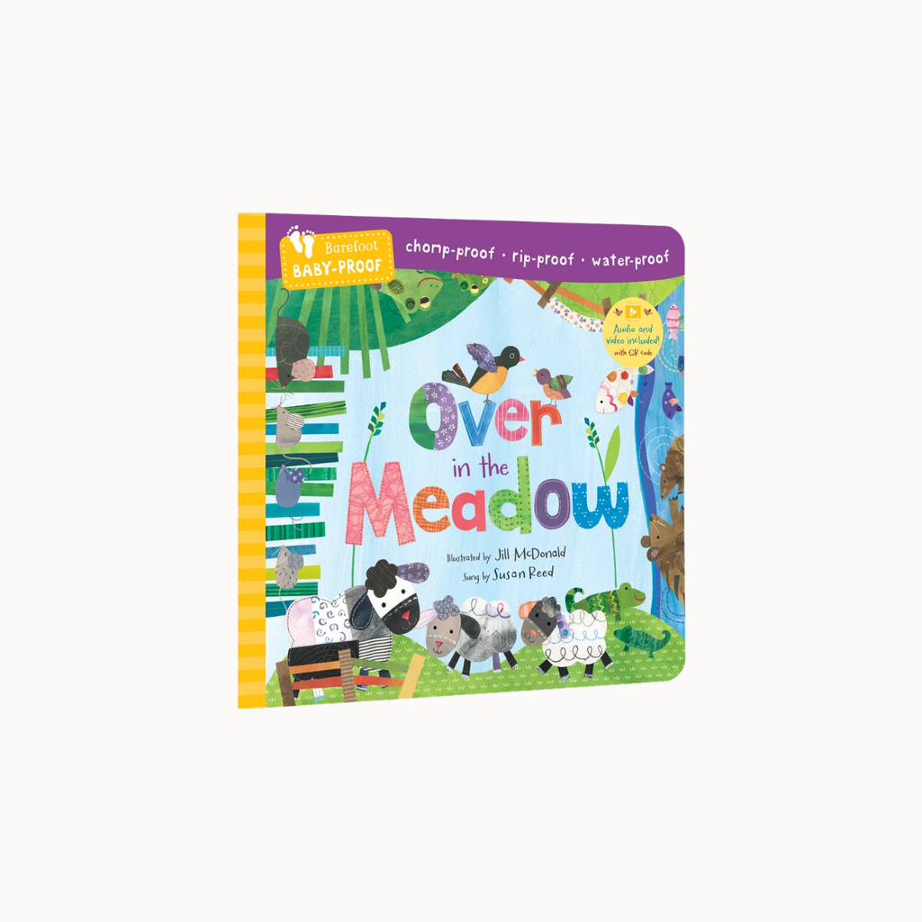 A children's board book titled "Over in the Meadow" shown on a plain light background. The cover is colorful with cartoon animals, grass, flowers, and rainbow lettering, and the spine is yellow with a baby-proof label at the top.